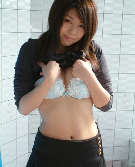 Japanese chick Rin models non nude in white lace underwear