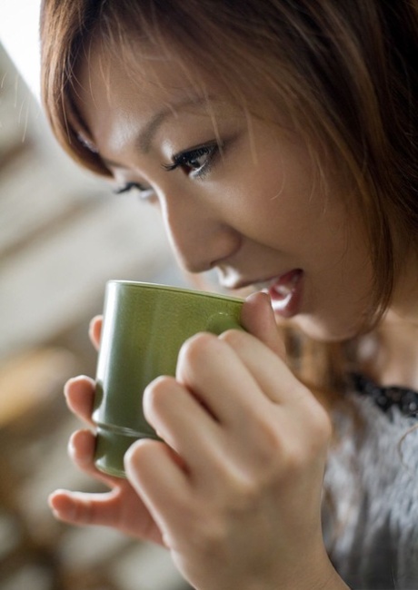 Emi Harukaze, a Japanese beauty, goes for a full body nude over a hot drink.