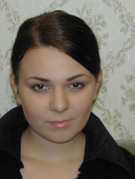 Youngster Olesya shows off her breasts before releasing her damp bush from hose.