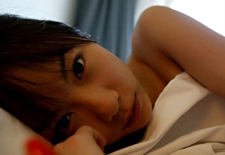 While getting changed, Kurumi Morishita, a Japanese girl, exhibits her firm tits.