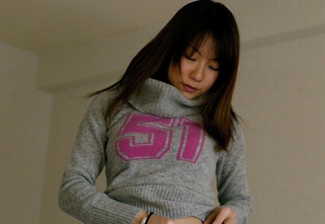 Changes: Japanese girl Kurumi Morishita shows off her hard tits (left) while getting changed.