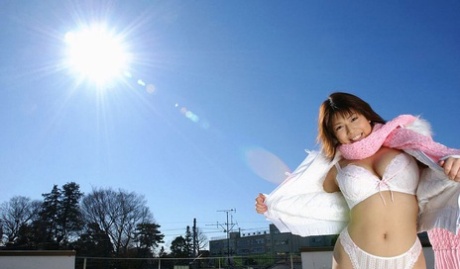 Mai Haruna, accompanied by her MILF of Japan, undresses her winter coat while wearing only a bra and thong.