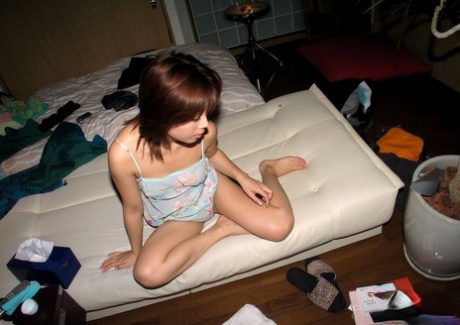Japanese teen Tomomi gets completely naked after arriving at her residence