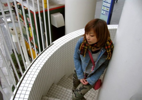 Kyoko, a redhead from Japan, gets naked and takes a bath after wandering the streets.