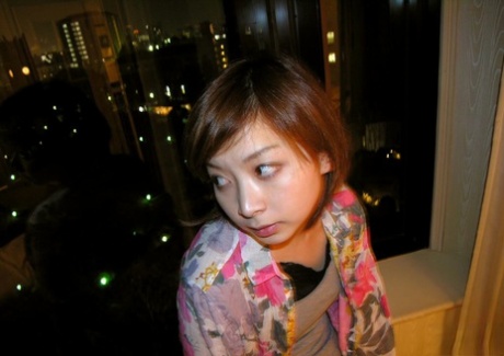 After walking around the streets, Kyoko (an American citizen) gets naked and takes a bath.