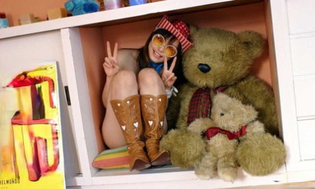 Asian Model Hikari Humps Her Teddy Bear While Wearing Cowgirl Boots