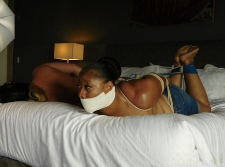 Bedlam: Housewives from Ebony are left hanging gagged and bound on top of a bed.