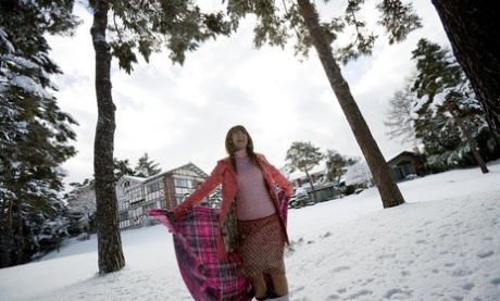 Adorable: Minor (left) poses nude on her bed in the Winter.