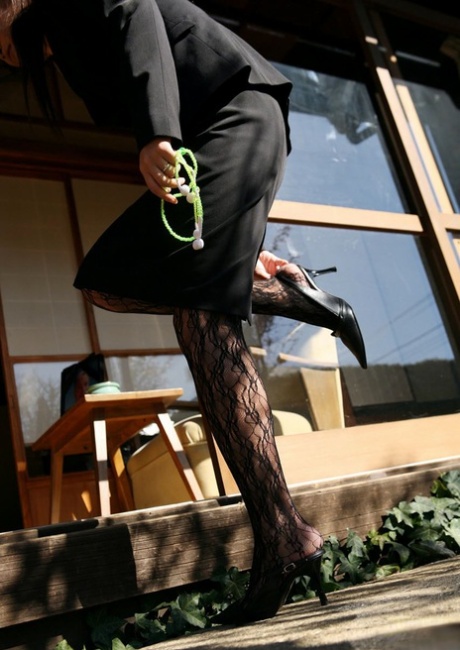 Grieving: Japanese widow Miho Sonoda (right) fondles herself after her husband's death.