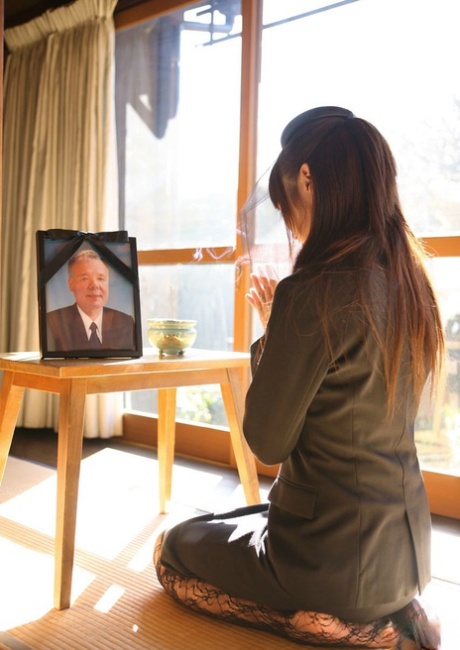 While mourning her husband's death, Miho Sonoda, a Japanese woman, holds herself together and fondles herself.