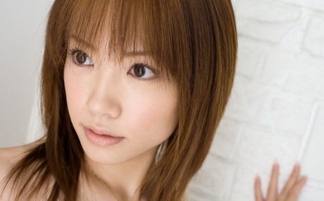 Japanese redhead Reika Shiina wears a transparent dress to expose her breast.