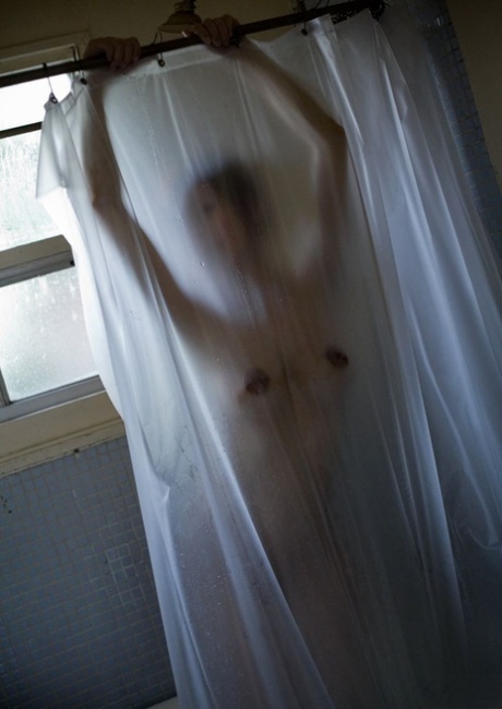 Japanese girl Emi Harukaze shows off her long nipples after she has taken a shower.