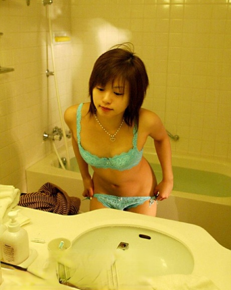 As he takes a bath, MILF Hitomi Hayasaka from Asia performs great nude poses.