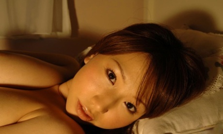 Japanese Beauty Ai Sayama Grabs A Full Breast While Posing In Her Bedroom