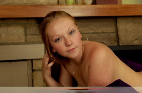 This is a young, single girl with long, red-haired men who gets naked and then shows her big buttocks.