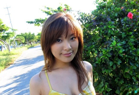 Superficial: This cute Asian model loves to pose by the beach while wearing tight tits and showing off her body language.