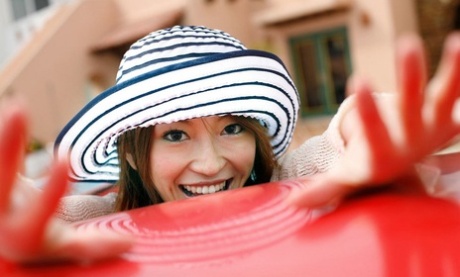 Yu Saotome, a Japanese girl with red hair, is seen wearing bikini and a hat while walking alone.