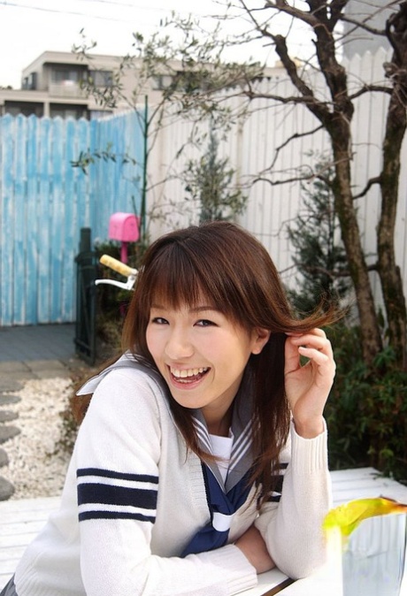 Cute: Towa Aino, a Japanese student, pulls off her breasts in a cute manner.
