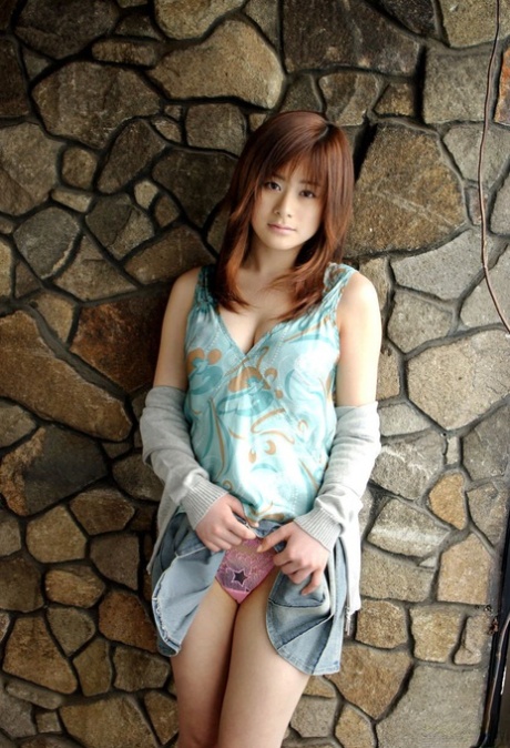 Japanese beauty Sumire Aida slips her see-through panties over her phallus.