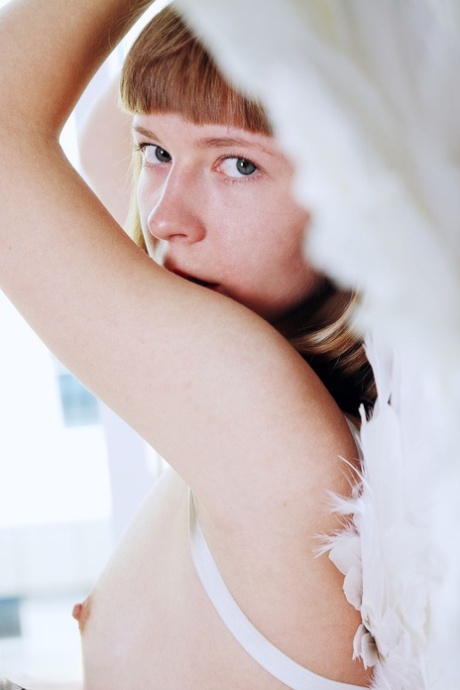 Charming teen Dream goes nude in red ballerina slippers and angel wings