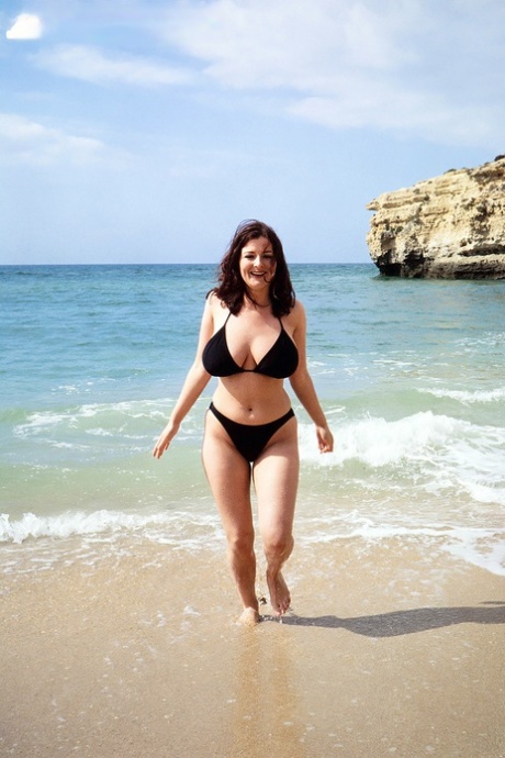 Brunette MILF Lorna Morgan Releases Her Nice Melons From Bikini On A Beach