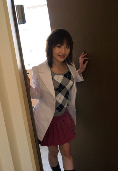 Japanese teen Saya bares her tits and bush while changing her clothes