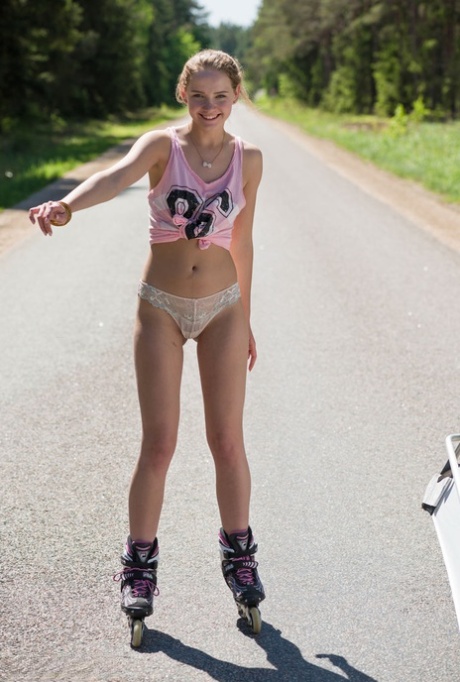 Young Blonde Girl Faina Gets Naked In Middle Of Road Wearing Roller Blades
