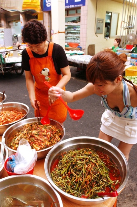 Before a nude solo shoot, Japanese redhead An Naba sampled street food.