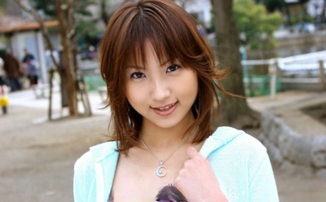 Japanese student Haruka poses nude inside her complex after flashing outside.