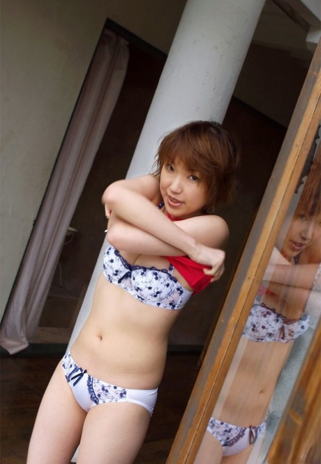 Japanese Redhead Madoka Places A Hand Over Her Cunt After Baring Her Boobs