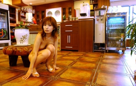 A Japanese girl gets naked at home while performing impressive solo poses.