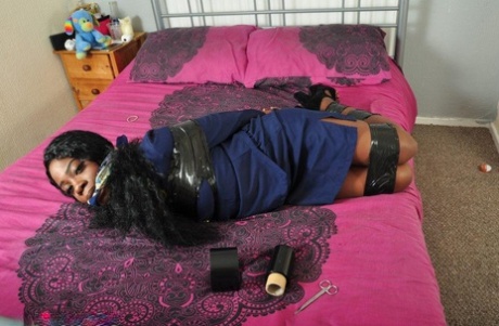 Black female stewardesses are left hogtied and cleave-grunged on a bed.