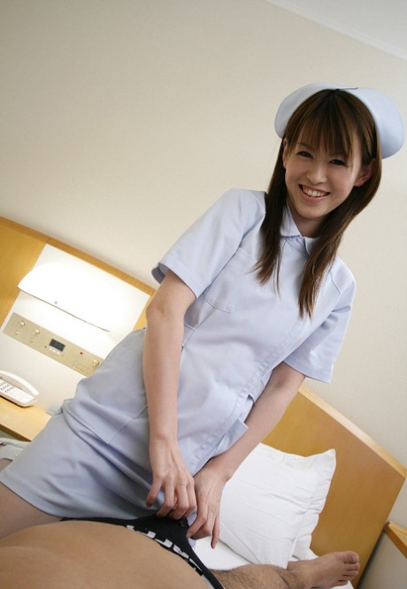 After kissing a patient, Himeno, a Japanese nurse, displays her natural tits and enjoys fondling them.