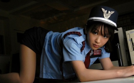 Riina, an Asian policewoman with sexy hands, fondles her tits while disrobing.