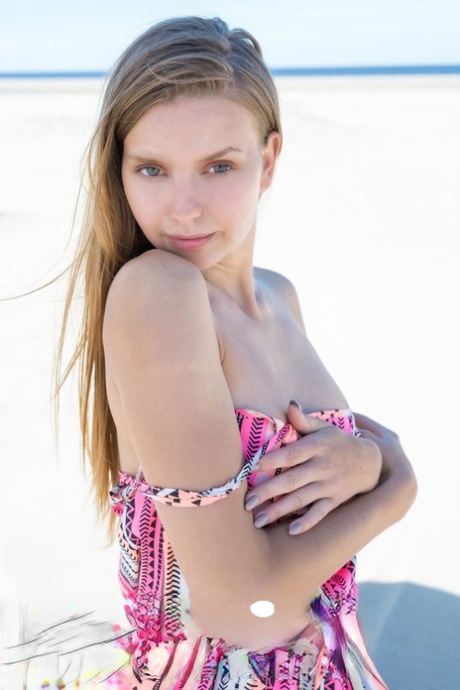 Teen solo girl Dominika works free of clothes to enjoy being nude at the beach