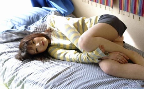 A Japanese girl named Kanan is seen changing her clothes at home while getting completely naked.