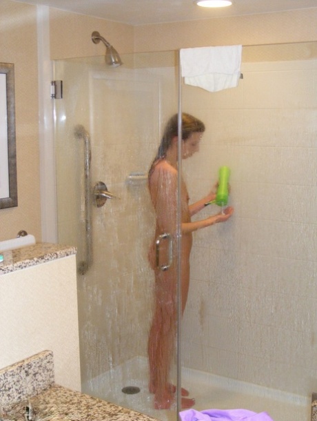 In the shower, a naked amateur named Alissa is caught dildoing while in the shower.