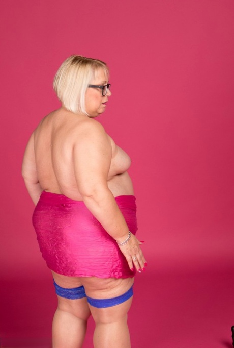 Topless models with blonde hair and fatty skin are depicted in Lexie Cummings' stockings and glasses.