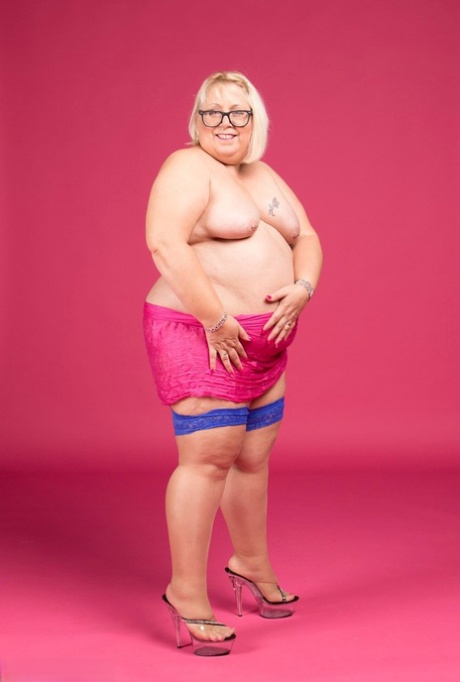 Lexie Cummings, who are blonde and fatty, don glasses and stockings to appear without clothing.