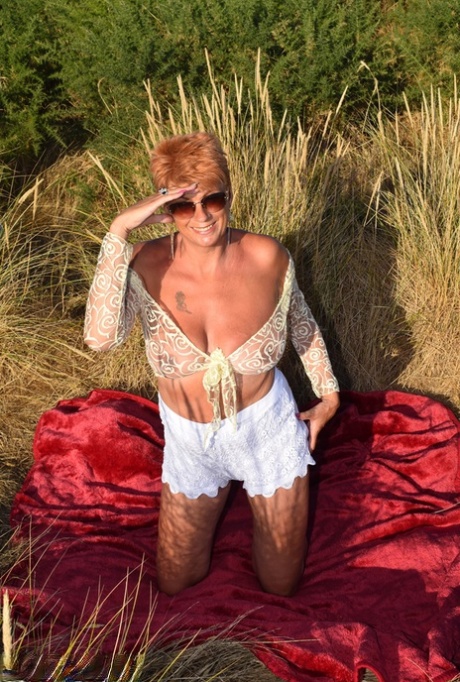 Proud old lady Dimonty reveals large animals on an open blanket that looks out over the sea.