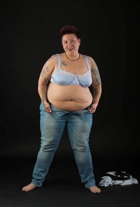 Tattoo Girl - A fat lady who is not a professional, but tattoos her chest and then cups her breasts after taking off her clothes.