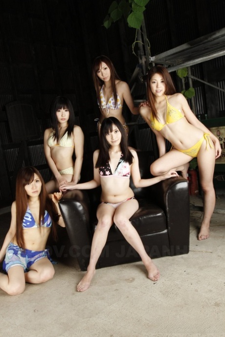 A multitude of Japanese women wear full-body attire while getting nude at the same time.