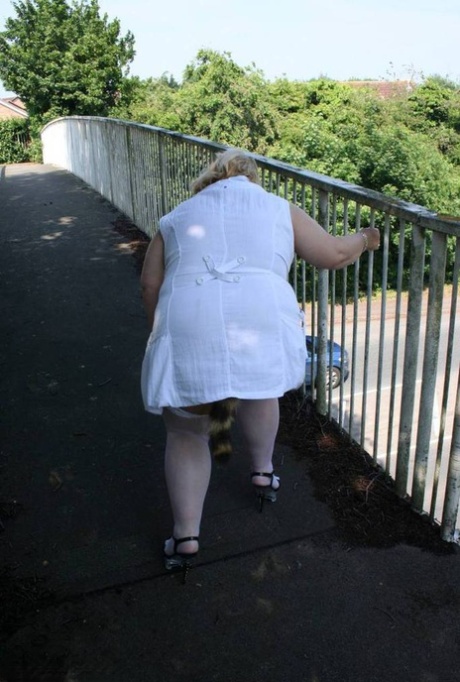 During the pedestrian overpass crossing, Lexie Cummings expose herself as she is both fat and blonde.
