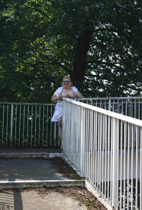 The weighty blonde Lexie Cummings bares herself as she crosses the pedestrian overpass.