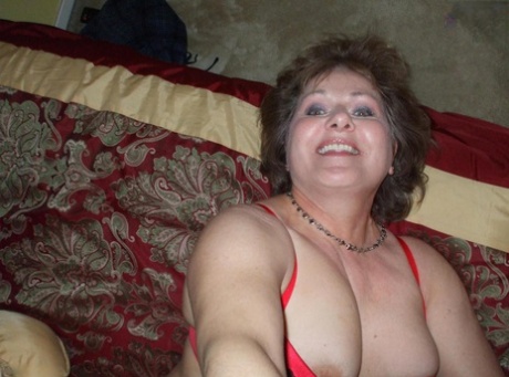 Prior to giving a POV blowjob, Busty Bliss, an older man, applies lip gloss.