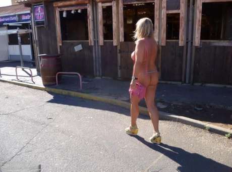 Nude Chrissy (the bustily blonde) walks around a nude resort, but in the majority, she is not wearing clothes.