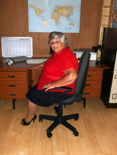 Obese British individual Grandmother Libby is seen in a naked state on the computer desk.
