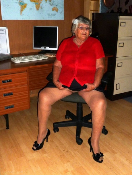 Old grandmother from Britain, Grandma Libby, gets completely naked on a computer desk.