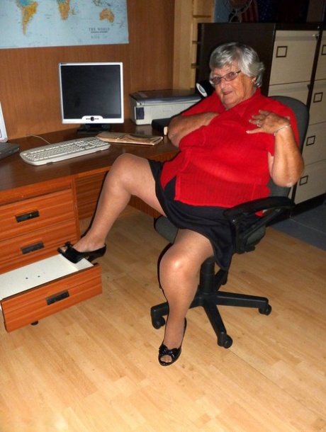 Despite being an older British woman, Grandma Libby is seen in a naked state on a computer desk.
