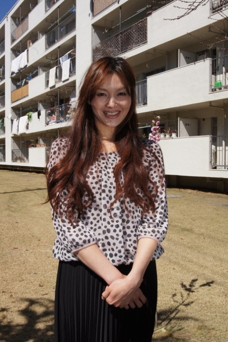 Japanese MILF Hitomi Kano Wears A Nice Smile While Modeling Non Nude